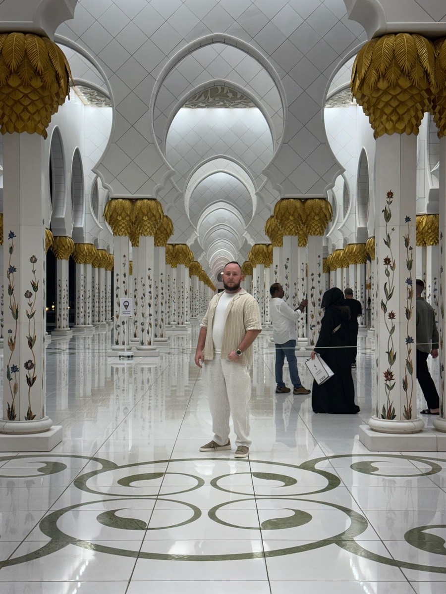 Standing among the gold-capped columns of the Sheikh Zayed Grand Mosque in Abu Dhabi